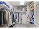 Spacious walk-in closet with an organized system for clothes at 9656 Paraiso Springs St, Las Vegas, NV 89139