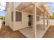 This cozy backyard features a covered patio and low-maintenance landscaping at 9740 Floweret Ave, Las Vegas, NV 89117