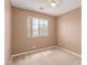 Neutral bedroom with a ceiling fan and a window providing natural light at 9740 Floweret Ave, Las Vegas, NV 89117