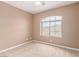 Cozy bedroom with a arched window, offering a view and plenty of natural light at 9740 Floweret Ave, Las Vegas, NV 89117