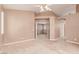 Spacious bedroom with plush carpeting and ceiling fan provides a comfortable and relaxing retreat at 9740 Floweret Ave, Las Vegas, NV 89117