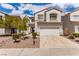Charming two-story home with a well-manicured front yard and attached two-car garage at 9740 Floweret Ave, Las Vegas, NV 89117
