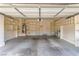 Spacious two-car garage with built-in shelving, offering ample storage space at 9740 Floweret Ave, Las Vegas, NV 89117