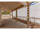 Covered patio area with stone landscaping offers a tranquil outdoor space at 9740 Floweret Ave, Las Vegas, NV 89117