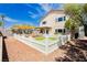 Spacious backyard featuring a white picket fence, gravel, and shade cover ideal for outdoor enjoyment at 977 Trackers Glen Ave, Henderson, NV 89015