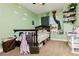 View of a cozy bedroom with a crib and window at 977 Trackers Glen Ave, Henderson, NV 89015