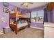 This bedroom includes a bunk bed with a window view and playful decor at 977 Trackers Glen Ave, Henderson, NV 89015