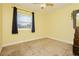 Sunny bedroom featuring a large window and cozy carpet, creating a warm and inviting space ready for personalization at 977 Trackers Glen Ave, Henderson, NV 89015