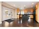 Open-concept kitchen featuring wooden cabinetry and stainless steel appliances at 977 Trackers Glen Ave, Henderson, NV 89015