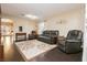 Relaxing living room featuring hardwood floors, neutral walls, and comfortable seating at 977 Trackers Glen Ave, Henderson, NV 89015
