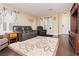 Inviting living room with hardwood floors, neutral paint, and large windows at 977 Trackers Glen Ave, Henderson, NV 89015