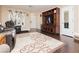 Cozy living room featuring a dark hardwood floor, neutral walls, and a large entertainment center at 977 Trackers Glen Ave, Henderson, NV 89015