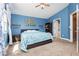 Blue bedroom showcasing a comfortable bed, side table, and decor that enhances the inviting and relaxing atmosphere at 977 Trackers Glen Ave, Henderson, NV 89015