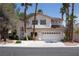 Inviting two-story home features a well-manicured lawn and a spacious two-car garage, enhancing its curb appeal at , Las Vegas, NV 89128