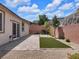 Private backyard featuring a paved patio, gravel, and artificial turf at 1063 Upper Springs St, Henderson, NV 89002