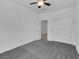 Neutral bedroom featuring plush carpeting, a ceiling fan and a closet with bi-fold doors at 1063 Upper Springs St, Henderson, NV 89002