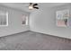 Inviting bedroom featuring a ceiling fan and a view of the neighborhood at 1063 Upper Springs St, Henderson, NV 89002