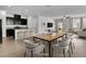 Open-concept dining area with modern furnishings, flowing into the kitchen and living spaces at 1063 Upper Springs St, Henderson, NV 89002