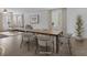 Bright dining area with a modern table and chairs, seamlessly connected to the living room at 1063 Upper Springs St, Henderson, NV 89002