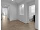 Bright hallway with tile flooring, built-in alcove and access to a bathroom and multiple rooms at 1063 Upper Springs St, Henderson, NV 89002