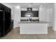 Modern kitchen featuring a large island, granite countertops, and stainless steel appliances at 1063 Upper Springs St, Henderson, NV 89002