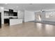 Open-concept living room featuring tile floors and sliding glass doors leading to the backyard at 1063 Upper Springs St, Henderson, NV 89002