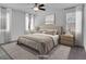 Serene main bedroom with soft lighting, neutral tones, and comfortable furnishings for relaxation at 1063 Upper Springs St, Henderson, NV 89002