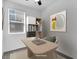 Functional office area with modern desk, chair, and built-in shelves, enhanced by bright natural light at 1063 Upper Springs St, Henderson, NV 89002