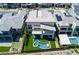 Aerial view of a modern home with a unique pool and lush landscaping at 10748 Steel Ridge Ct, Las Vegas, NV 89135