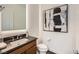 Powder room featuring a floating vanity, and stylish fixtures at 10748 Steel Ridge Ct, Las Vegas, NV 89135