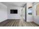 Bedroom features luxury vinyl plank flooring, recessed lighting, and an open entry to the bathroom at 10748 Steel Ridge Ct, Las Vegas, NV 89135
