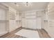 Bright walk-in closet with custom shelving and drawers, offering ample storage space at 10748 Steel Ridge Ct, Las Vegas, NV 89135