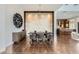 Elegant dining area with statement lighting and direct access to the kitchen at 10748 Steel Ridge Ct, Las Vegas, NV 89135
