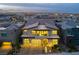 Stunning two-story home with a modern design, three-car garage, and beautifully landscaped front yard at 10748 Steel Ridge Ct, Las Vegas, NV 89135