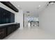 Spacious hallway with sleek tile flooring, modern lighting, and an open view of the home's interior design at 10748 Steel Ridge Ct, Las Vegas, NV 89135