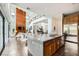 Modern kitchen with a large island, stainless steel appliances, and open view to the living room at 10748 Steel Ridge Ct, Las Vegas, NV 89135
