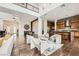 Bright open concept living room with high ceiling and modern kitchen at 10748 Steel Ridge Ct, Las Vegas, NV 89135