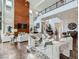 Bright living room features a high ceiling, a fireplace, and contemporary furnishings at 10748 Steel Ridge Ct, Las Vegas, NV 89135