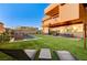 Beautifully landscaped backyard with a pool, lounge chairs, and ample space for outdoor activities at 1181 Calle De Luz, Henderson, NV 89012