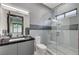 Modern bathroom featuring a glass shower, sleek tile, and a stylish vanity at 1181 Calle De Luz, Henderson, NV 89012