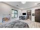 This neutral bedroom features wood floors, an ensuite bathroom, and a walk-in closet at 1181 Calle De Luz, Henderson, NV 89012