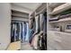 Well-organized walk-in closet with shelving, hanging rods, drawers, and a bench for added convenience at 1181 Calle De Luz, Henderson, NV 89012