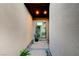 Modern entryway with stone accents, potted plant and window view to the interior at 1181 Calle De Luz, Henderson, NV 89012