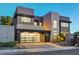 Modern home showcasing stylish garage, sleek architecture, and landscape design at 1181 Calle De Luz, Henderson, NV 89012