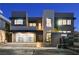 Modern home showcasing stylish garage, sleek architecture, and illuminated exterior at 1181 Calle De Luz, Henderson, NV 89012