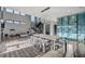 Bright, open-concept living area with modern dining set, stylish kitchen, and floating staircase at 1181 Calle De Luz, Henderson, NV 89012