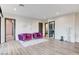 Bright living room featuring hardwood floors, modern decor, and comfortable purple armchairs at 1181 Calle De Luz, Henderson, NV 89012
