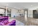 Bright living room featuring hardwood floors, modern decor, and comfortable purple armchairs at 1181 Calle De Luz, Henderson, NV 89012