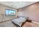 Primary bedroom features a large window, a modern light fixture, and wooden floors at 1181 Calle De Luz, Henderson, NV 89012