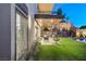 Picturesque patio with lush landscaping, a comfortable seating area, and relaxing backyard ambience at 1181 Calle De Luz, Henderson, NV 89012
